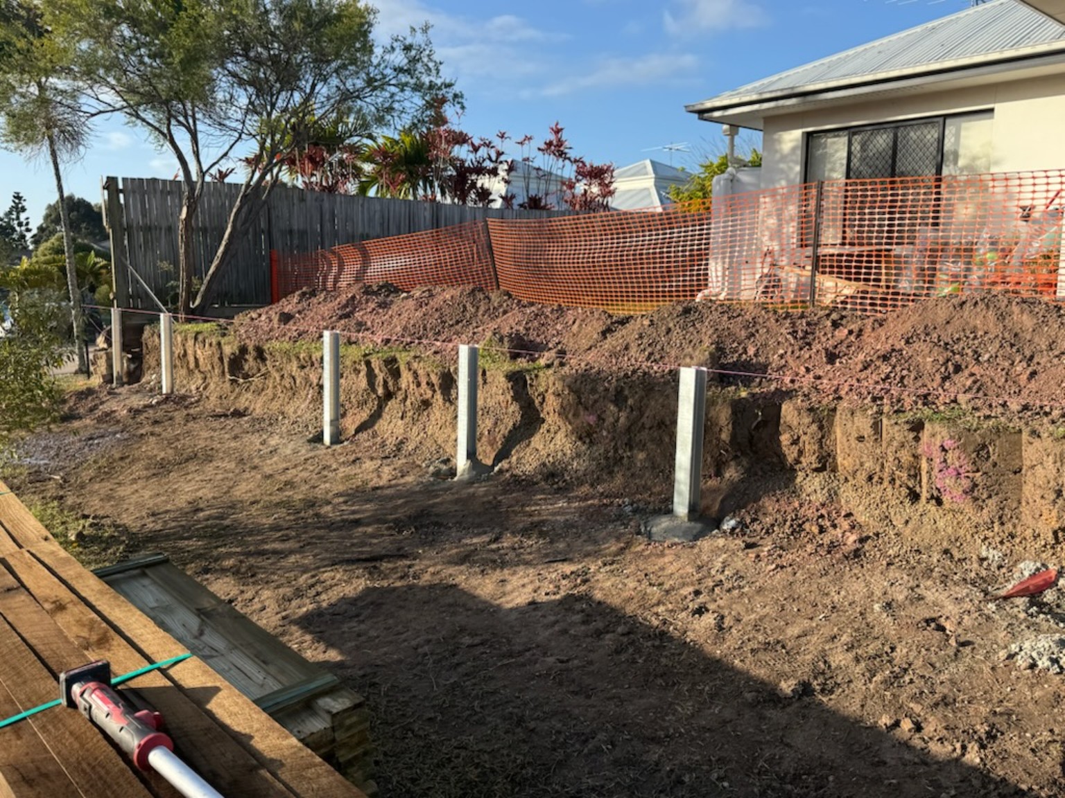 Retaining wall posts during construction