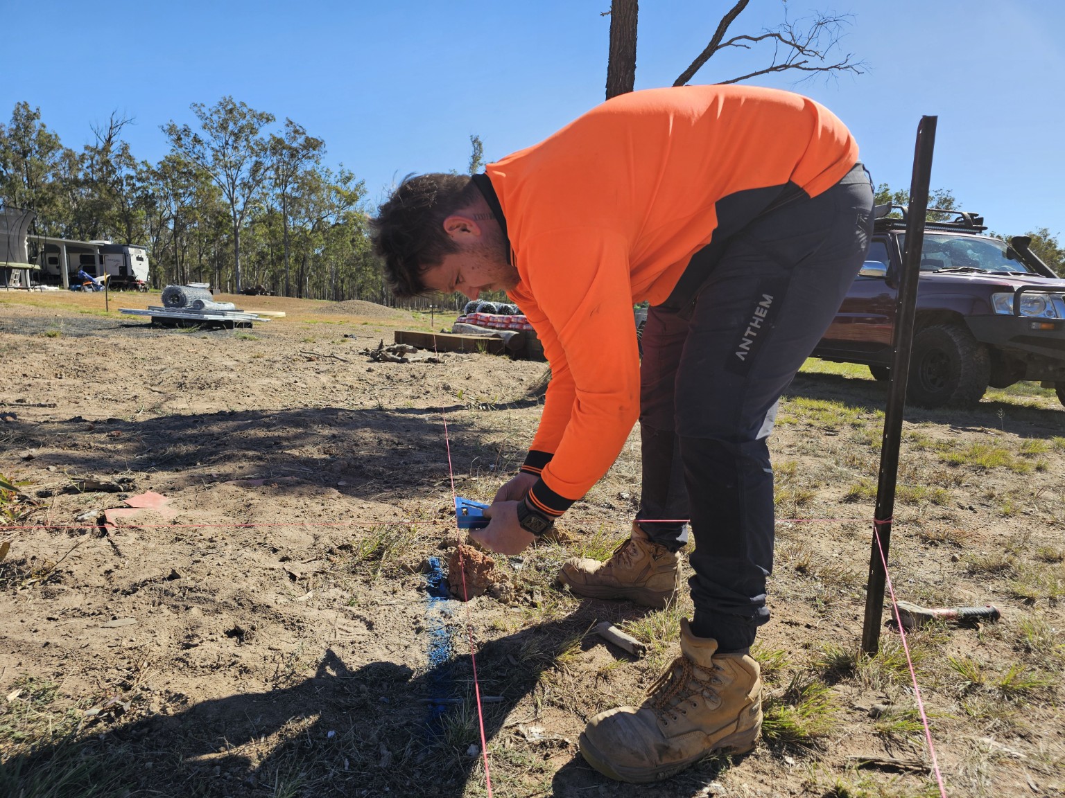 Blissful team member setting out ground works